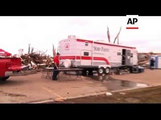 Rescuers refused to be deterred from their efforts to find survivors beneath Joplin's jagged piles o