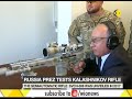 putin shows off marksmanship skills fires new kalashnikov rifle