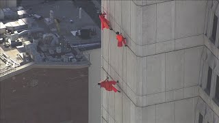 Dance group performs on side of Transamerica Pyramid