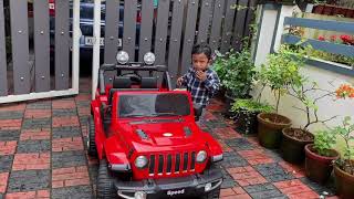 Kid experiencing new toy car - Jeep Wrangler - Ambadi