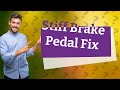 Why is my push button start brake pedal stiff?