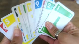 Playing Phase 10 card game, perfect for family night!