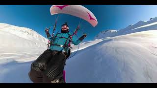 Man Paramotors While Skiing Over Snow Covered Mountains - 1176912-1