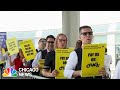 Flight attendants PROTEST outside Chicago's O'Hare Airport