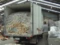 shred truck unloading shredded paper