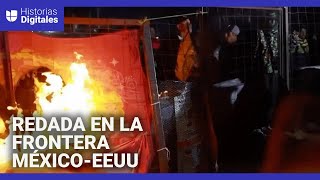 Migrantes prenden fuego durante redada nocturna en un campamento en la frontera entre México y EEUU