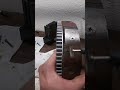 Grinding rust away from a flywheel magnet.