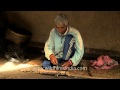 Old man making some bamboo items in Manipur