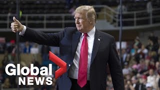 Migrant caravan takes centre stage during Donald Trump's Mississippi rally