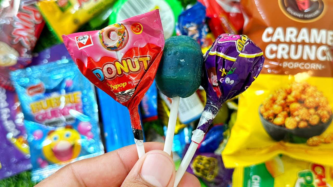 Mesmerising Lollipops Cute Rainbow Candies And Chocolates Unpacking