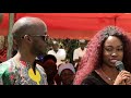 Luo girl from America speaking at a funeral in Kenya