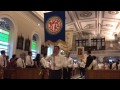 Banners being carried in during the dedication of the Cathedral of the Good Shepherd