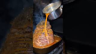 Ham gettin' a baste bath, consisting of honey, butter, maple, gochujang, and chicken broth.