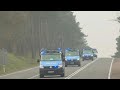 Police vans at checkpoint of entrance to emergency zone near Polish-Belarusian border | AFP