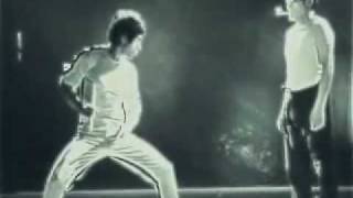 Bruce Lee Lighting Matches with Nunchucks