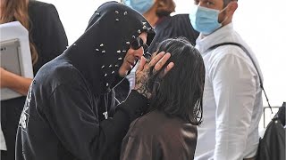 Kourtney Kardashian kisses and cosies up to beau Travis Barker as the pair arrive at Venice Film...