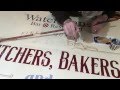 Adding some scroll work to an aged looking sign.