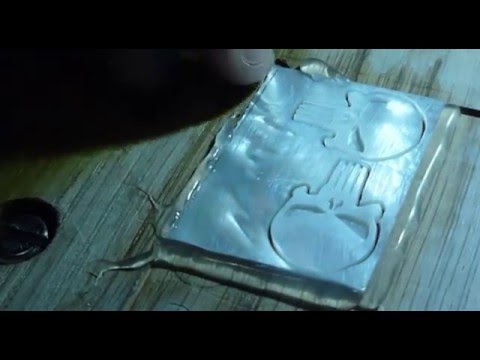 Popping out the mother of pearl Punisher inlays. Popping out the mother of pearl Punisher inlays.