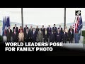 Leaders of G7 and guest countries pose for family photo