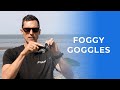 How do I best clear fog from my goggles?