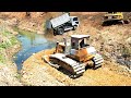 Wonderful Heavy Old Bulldozer SHANTUI Working push stone and Dump truck 5T unloading stone filling.