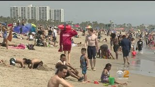 Thousands Hit The Beach To Escape Triple-Digit Temperatures