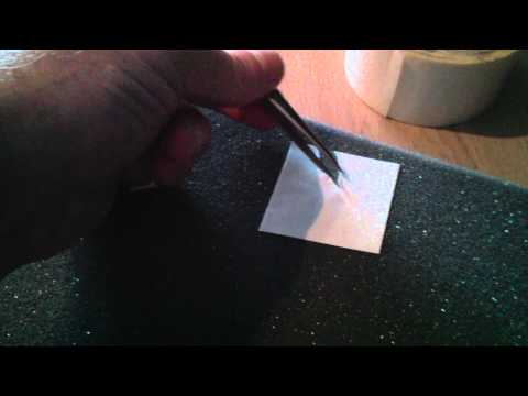 Removing the backing from double-sided sticky tape. Quickly! Removing the backing from double-sided sticky tape. Quickly!