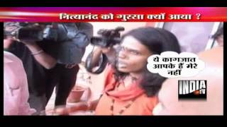 Nityananda flares up on seeing TV reporter  showing summons