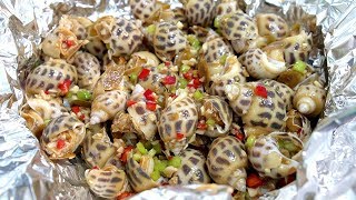 The practice of Cantonese food ginger baked with snails, it looks like they are fragrant