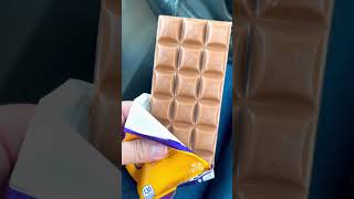 Unwrapping Cadbury dairy MILKA candy bar, chocolate caramel #shorts #asmr