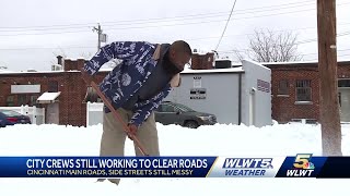 City crews, neighbors working to clear snow from roads