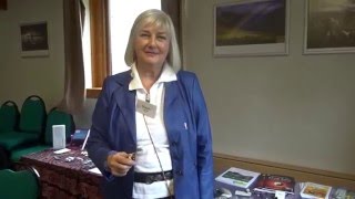 Susan Collins demonstrates dowsing with a bobber.