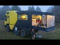 CARAVAN CAMPING WITH A WOOD-BURNING STOVE IN THE RAIN