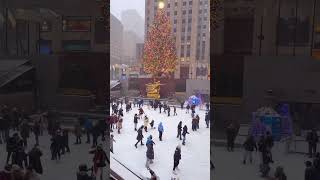 Snowy Christmas Eve morning at Rockefeller Center Skating Rink in New York City