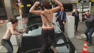 Topless Femen activists attack the Tunisian PM in Brussels