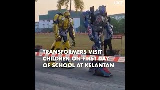 Transformers Visit Children On First Day of School at Kelantan