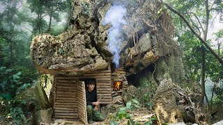 I Spent 7 Days Building a Warm and Cozy Survival Shelter under a giant Rock. Primitive Shelter Cave