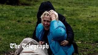 Ukraine war: distraught woman mourns father as Kharkiv sustains heavy attacks