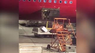 Worker tosses luggage haphazardly off Alaska Airlines jet | ABC7