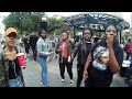 several ladies play shakers during hare krishna chant at union square