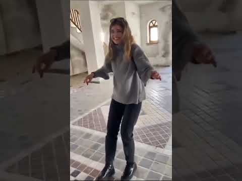 Which town has a church with a crooked spire?