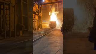 A ladle dumping metal onto another ladle at Commercial Metals in Sayreville NJ