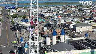 DANGEROUS CLIMB: Man climbs famous Seaside Heights, New Jersey ride on Casino Pier in protest.