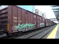 northbound bnsf priority manifest train passes through the king street station.