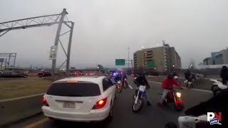 A Group Of ATV And Dirt Bike Riders Take Over A Massachusetts Highway