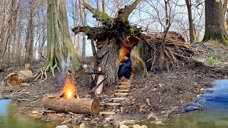 Building a secret shelter inside a fallen tree near a mystical lake