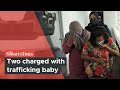 Two charged with trafficking baby