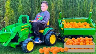 Artem Rides on Tractor \ Kids Pretend Play riding on Truck Toys gathering Orange