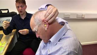 Simon Field, technical specialist for the  3M™ E-A-Rfit™ Dual-Ear Validation demonstrates the system