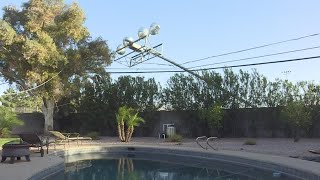 Wind sends stadium light tumbling onto power lines in northeast Phoenix